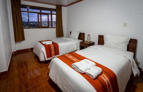 Explorer Deluxe Hotelにあるベッド