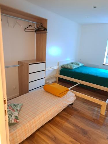 Posteľ alebo postele v izbe v ubytovaní Appartement confort Thionville