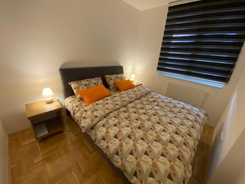 Postel nebo postele na pokoji v ubytování Apartman Vuki