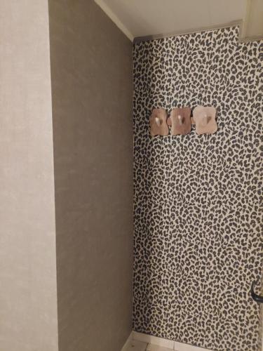 a bathroom with two towels on a wall at A mon Châl in Waimes