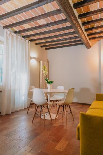 a dining room with a table and chairs at Locanda Del Feudo Suite & Restaurant in Castelvetro di Modena