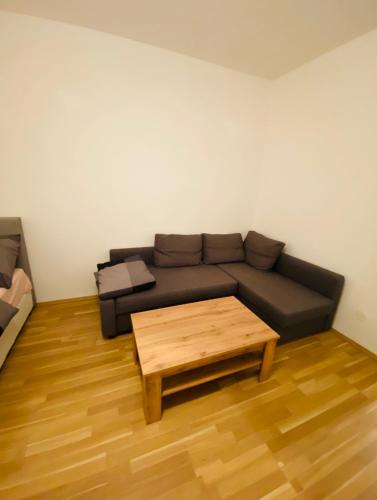 a living room with a couch and a coffee table at Nice apartment Hollergasse 22 in Vienna