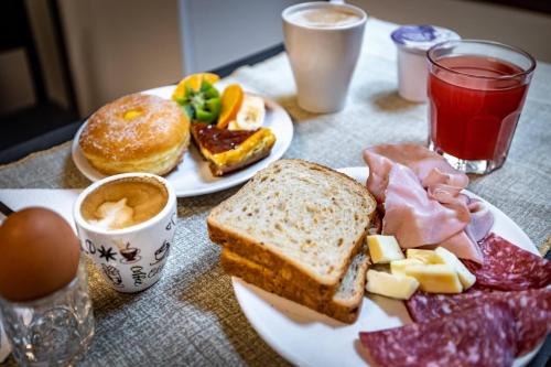 a table with two plates of breakfast food on it at B&B Lorenzo de' Medici in Florence