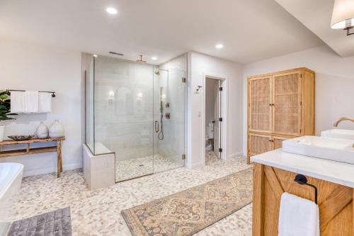 a bathroom with a shower and a sink at The Crew House in Tillamook