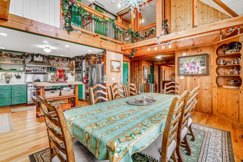 a dining room with a table and a kitchen at Slice of Life in Seaside