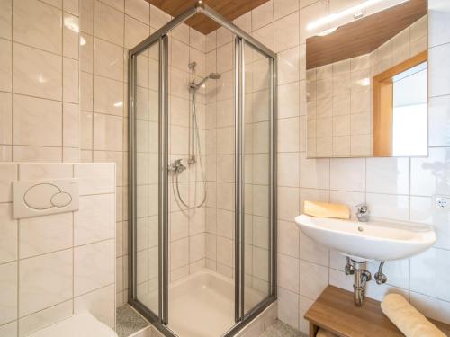 a bathroom with a shower and a sink at Sonnenwinkel II in Kolsassberg
