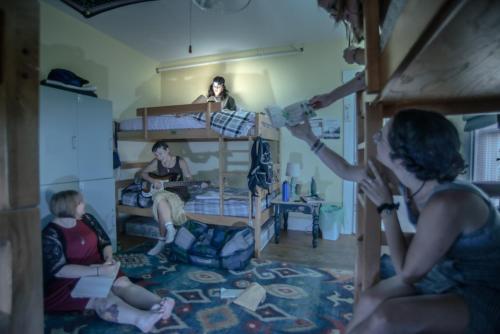 a group of people in a room with a bunk bed at CoHo: Conway Hostel in Conway