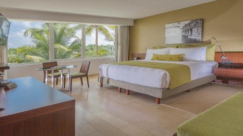 Postel nebo postele na pokoji v ubytování Presidente InterContinental Cancun Resort