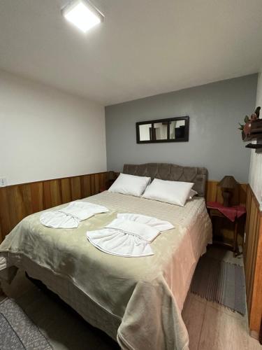 Postel nebo postele na pokoji v ubytování Chalés Grindelwald