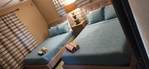מיטה או מיטות בחדר ב-Villa near Crash Boat Beach Aguadilla, PR 2nd flr