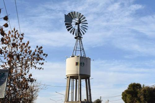 a windmill sitting on top of a building at Casa Ossès -Tu casa en Vista Flores!Hermosa casa de vacaciones in Vista Flores
