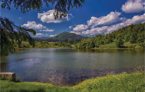 a view of a lake with mountains in the background at 3 Bedroom Nice Home In Crni Lug in Crni Lug