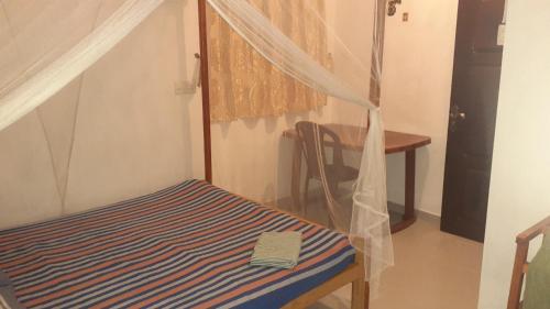 Ein Bett oder Betten in einem Zimmer der Unterkunft Rusara Guest Home