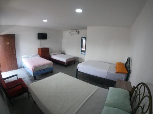 Postel nebo postele na pokoji v ubytování Hostal El Naufrago 1