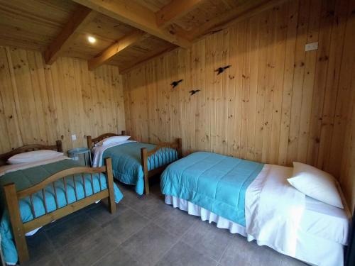 Katil atau katil-katil dalam bilik di Cabaña de campo