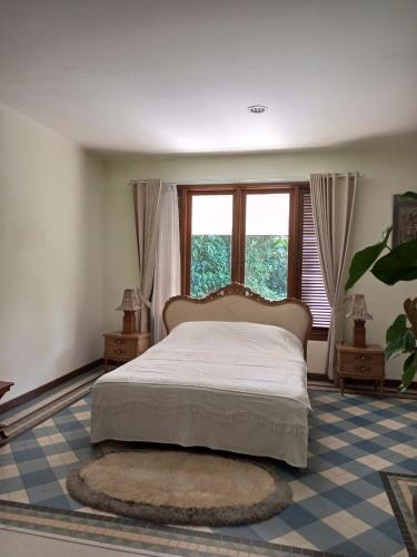 Postel nebo postele na pokoji v ubytování Gardenia Park Villa Melur