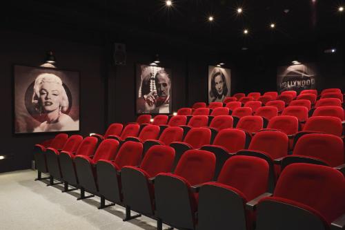 an empty auditorium with red seats in a theatre at LUX* Grand Gaube Resort & Villas in Grand Gaube
