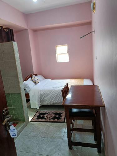 Ein Bett oder Betten in einem Zimmer der Unterkunft Sislink Hotel