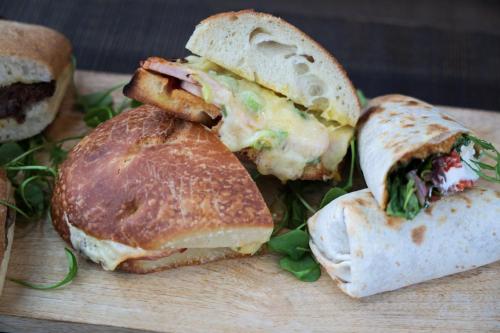 a sandwich cut in half on a cutting board at Wildlands Galway in Moycullen