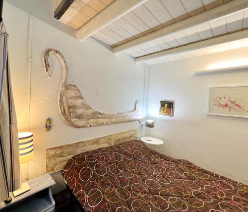 Ένα ή περισσότερα κρεβάτια σε δωμάτιο στο Casa della Ghiacciaia