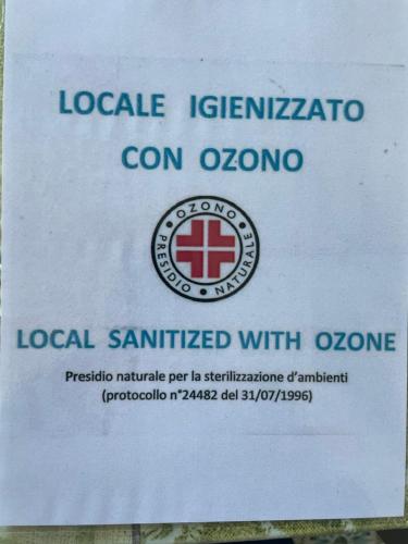 a sign that reads local sanitized with an emergency sign at Trentatre Quarantatre in Mola di Bari