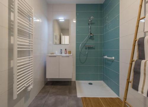 a bathroom with a shower and a sink at Domaine le Caprougeat in Daux