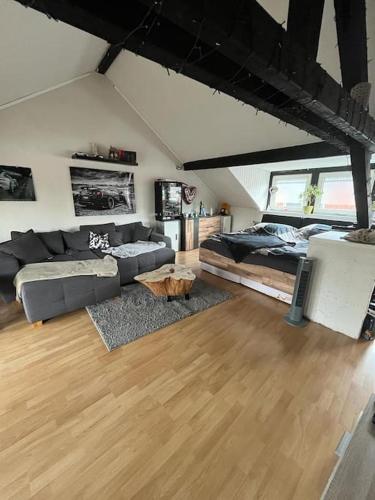 a living room with a couch and a table at Apartment Gartenblick in Alsdorf
