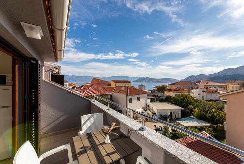 a balcony with a view of a city at Apartments Crneković III in Baška