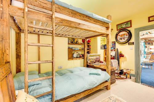 a bedroom with two bunk beds in a room at Family Country Cottage with a private Valley View in Scarborough