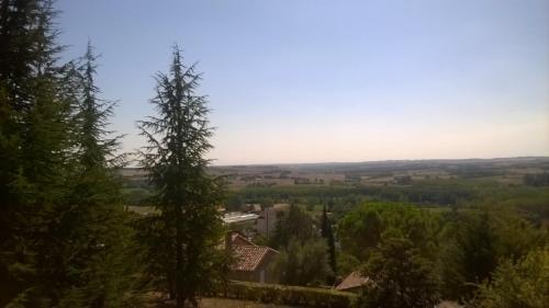 a view of the countryside from a hill with trees at Gîte de Claire in Lectoure