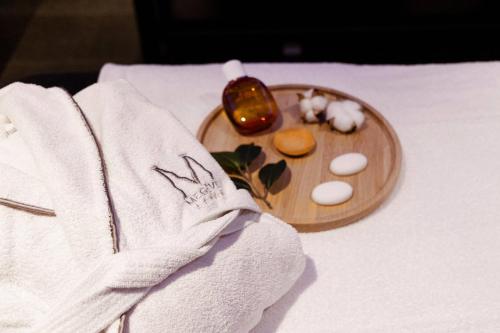 a plate of food on a table with a towel at M de Megève in Megève