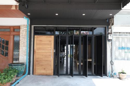an entrance to a building with a wooden door at The Cube Hostel Khaosan in Bangkok