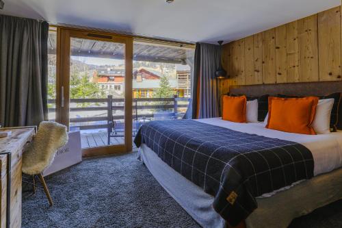 Postel nebo postele na pokoji v ubytování M de Megève
