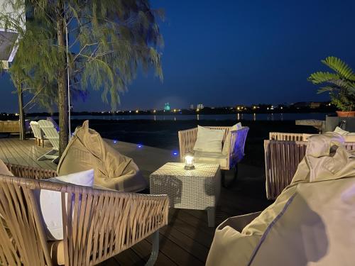 a patio with a table and chairs at night at WR Light Travel Warm Rice in Suao