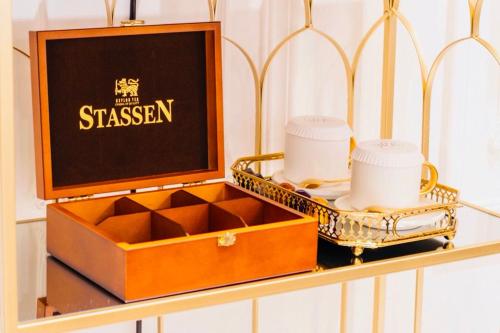 a wooden box with two cups and a tray of dishes at WR Light Travel Warm Rice in Suao