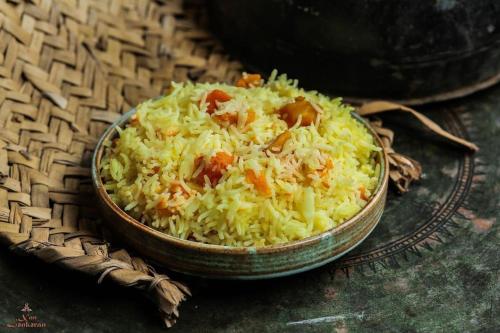 a bowl of rice sitting on a table at Khan Lankaran Hotel in Lankaran
