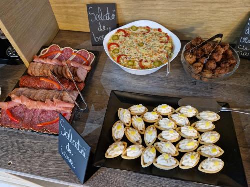 a display of seafood and other food on a table at New Wolf in Bran