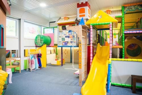 a play room with a slide at Penzion Troja in Lipany