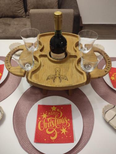 a bottle of wine on a tray on a table at Vila Helena in Kolašin