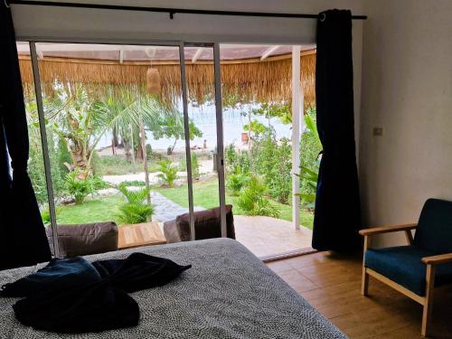 Ένα ή περισσότερα κρεβάτια σε δωμάτιο στο Secret Beach Bungalows