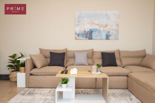 a living room with a couch and a coffee table at Prime Select New Giza in Giza