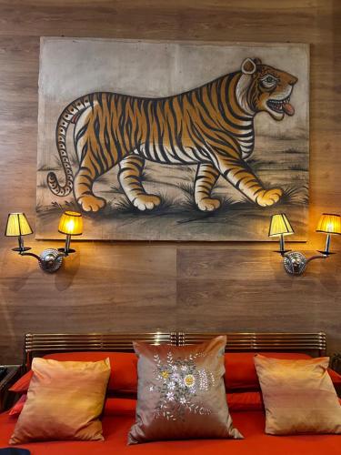 a painting of a tiger hanging on a wall at LU Suites in Turin
