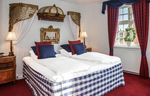 Postel nebo postele na pokoji v ubytování Hotel Kirstine