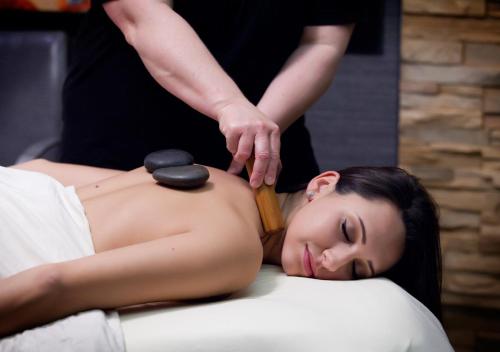 a woman getting a massage from a therapist at Oglebay Resort in Wheeling