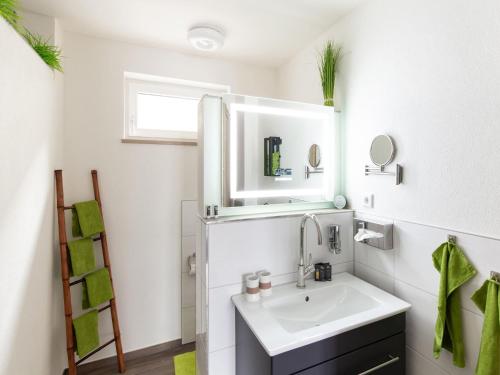 a bathroom with a sink and a mirror at Cozy holiday home in Bavaria in a charming area in Beilngries