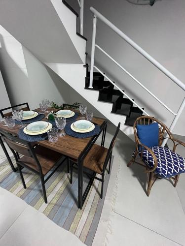 a dining room with a table and two chairs at Chalé Amarelo in Itanhaém