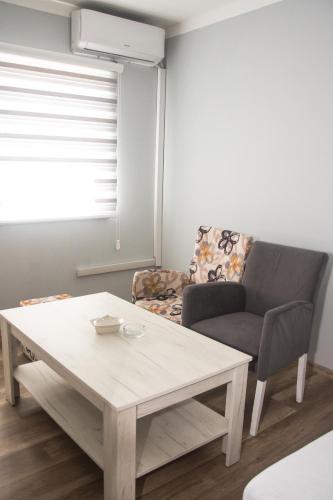 a living room with a coffee table and a couch at Motel Aura in Višegrad