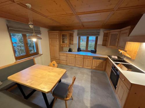 an overhead view of a kitchen with a wooden table at LUSE Living in Maurach
