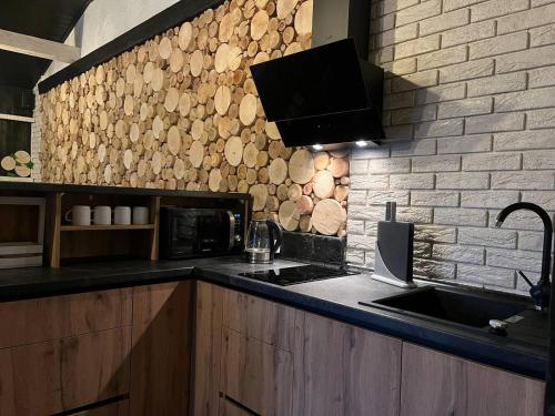 a kitchen with a sink and a counter top at Tustan Apart in Urych