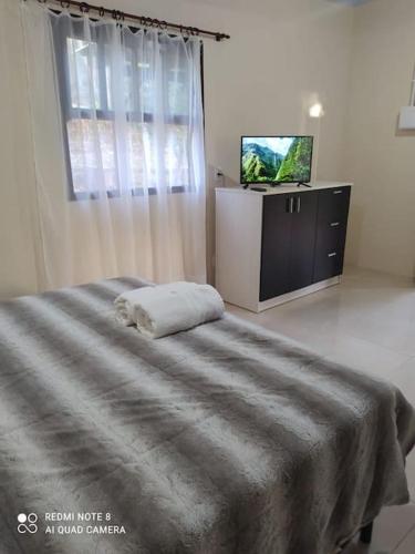 Un pat sau paturi într-o cameră la Casa Hermosa